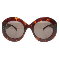 Alaïa Lunettes de soleil en Marron