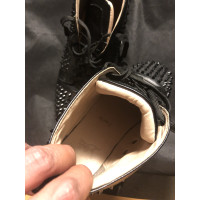 Christian Louboutin Sneakers aus Leder in Schwarz