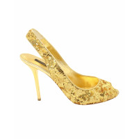 Louis Vuitton Sandalen aus Leder in Gold