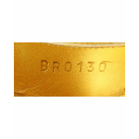 Louis Vuitton Sandalen aus Leder in Gold