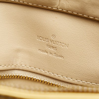 Louis Vuitton Houston Leer in Beige