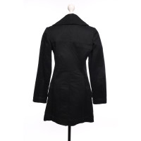 Alaïa Jacke/Mantel aus Baumwolle in Schwarz