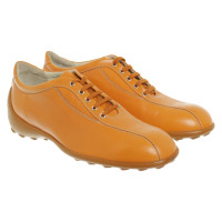Tod's Chaussures à lacets en Cuir en Orange