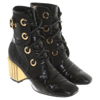 Christian Dior Ankle boots in black / gold
