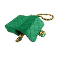 Chanel Necklace with emerald green mini flap bag