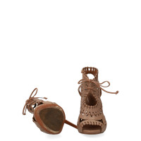 Alaïa Sandalen aus Leder in Beige