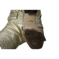 Gucci Ankle boots Leather in Gold
