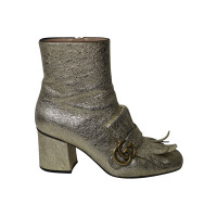 Gucci Ankle boots Leather in Gold
