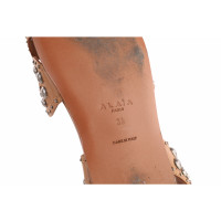 Alaïa Sandalen aus Leder in Braun