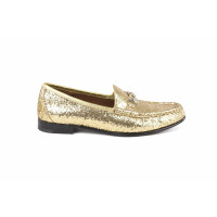 Gucci Slippers/Ballerina's in Goud