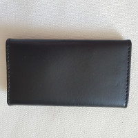 Coccinelle Täschchen/Portemonnaie aus Leder in Schwarz