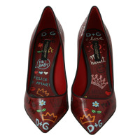 Dolce & Gabbana Pumps/Peeptoes aus Leder in Rot