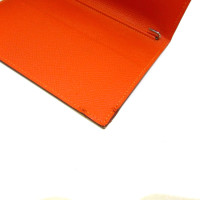 Hermès Sac à main/Portefeuille en Cuir en Orange