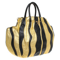 Prada Handbag in gold / black