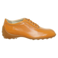 Tod's Chaussures à lacets en Cuir en Orange