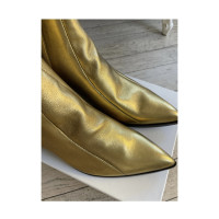 Saint Laurent Stiefeletten aus Leder in Gold