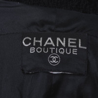 Chanel Kostuum gemaakt van bouclé-materiaal