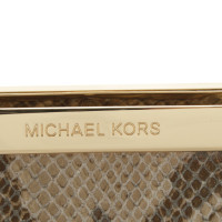 Michael Kors clutch in reptile optics