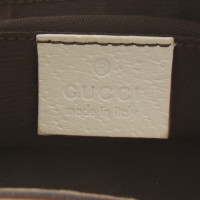 Gucci clutch avec des motifs de Guccissima