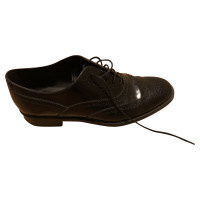Tod's Chaussures à lacets en Cuir en Noir