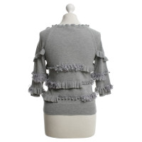 Autres marques Tricotée et flambage - Top en tricot en gris