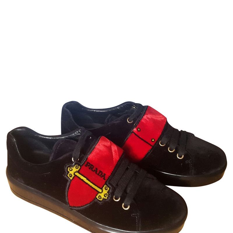 prada trainers black and red