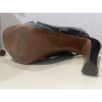 Alaïa Sandals Patent leather in Black