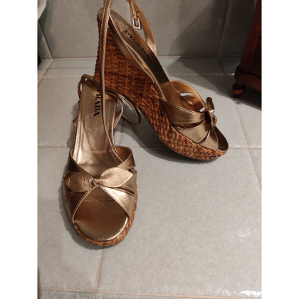Prada Wedges Leather in Gold