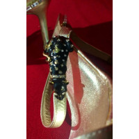 Dolce & Gabbana Sandalen aus Leder in Gold