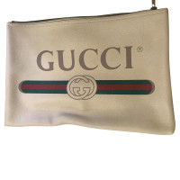 Gucci clutch avec logo imprimé