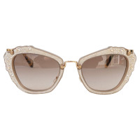 Miu Miu Sunglasses in Gold