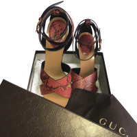 Gucci Red python heel sandals.