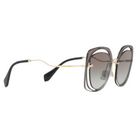 Miu Miu Sonnenbrille in Gold