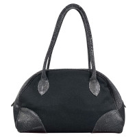 Alaïa Handtasche aus Wolle in Schwarz