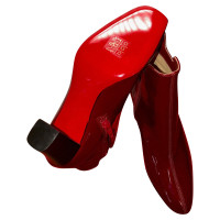 Christian Louboutin Stiefeletten aus Lackleder in Rot