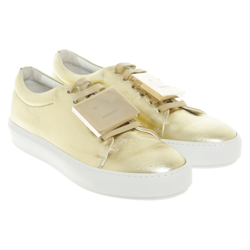Acne Sneakers aus Leder in Gold