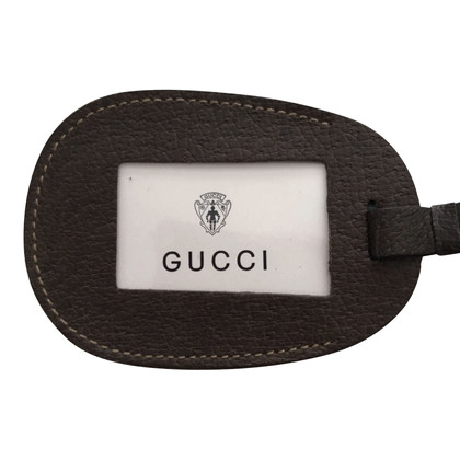 Gucci Täschchen/Portemonnaie aus Leder in Braun
