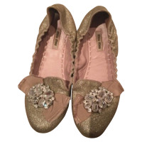 Miu Miu Slippers/Ballerina's in Goud