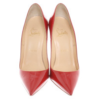 Christian Louboutin Patent leather pumps in red
