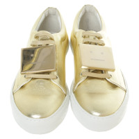 Acne Sneakers aus Leder in Gold