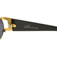 Gianni Versace Lunettes de soleil en noir / or