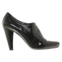 Prada Laced leather ankle boots in black