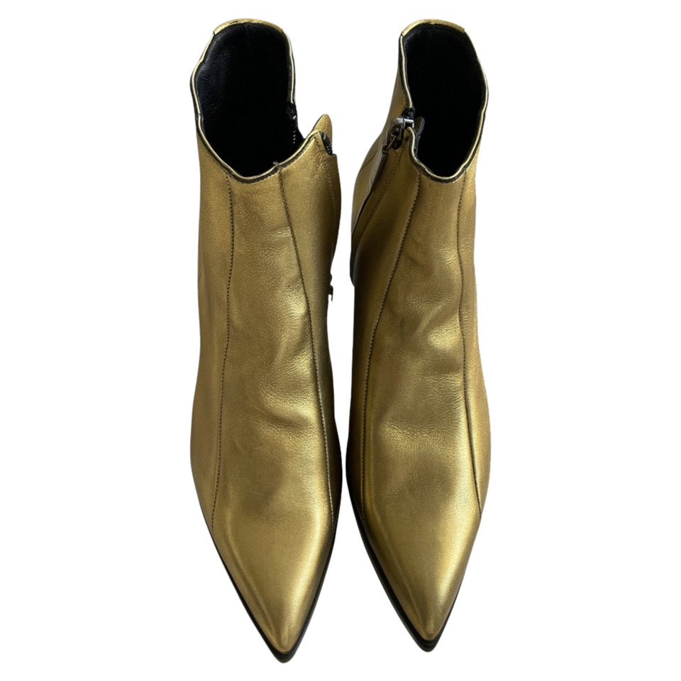 Saint Laurent Ankle boots Leather in Gold
