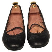 Alaïa Slippers/Ballerina's Leer in Zwart