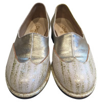 Chanel Slippers/Ballerina's Leer in Goud