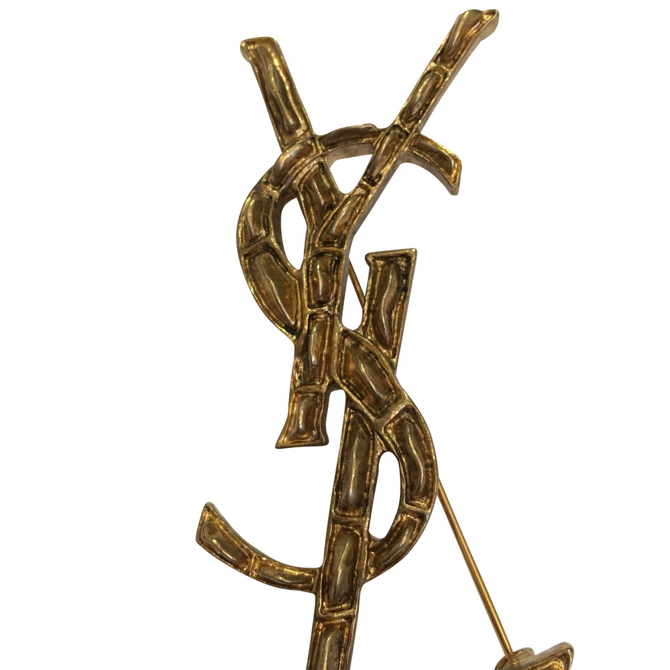 Yves Saint Laurent Lapel pin golden
