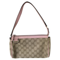 Gucci clutch avec le motif Guccissima