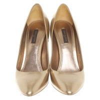 Louis Vuitton Pumps/Peeptoes Patent leather in Gold