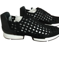 Hermès Sneakers aus Canvas in Schwarz