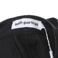 Self Portrait pantaloni di pelle imitazione in nero